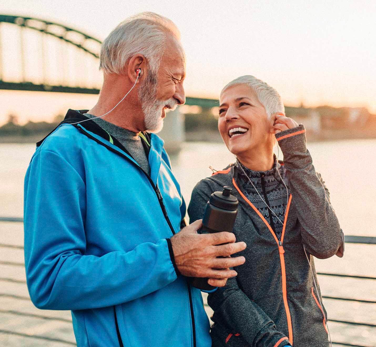 a couple smiling after their invisalign and retainer consultation