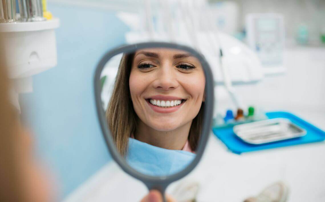 Woman smiling after Invisalign treatment in York