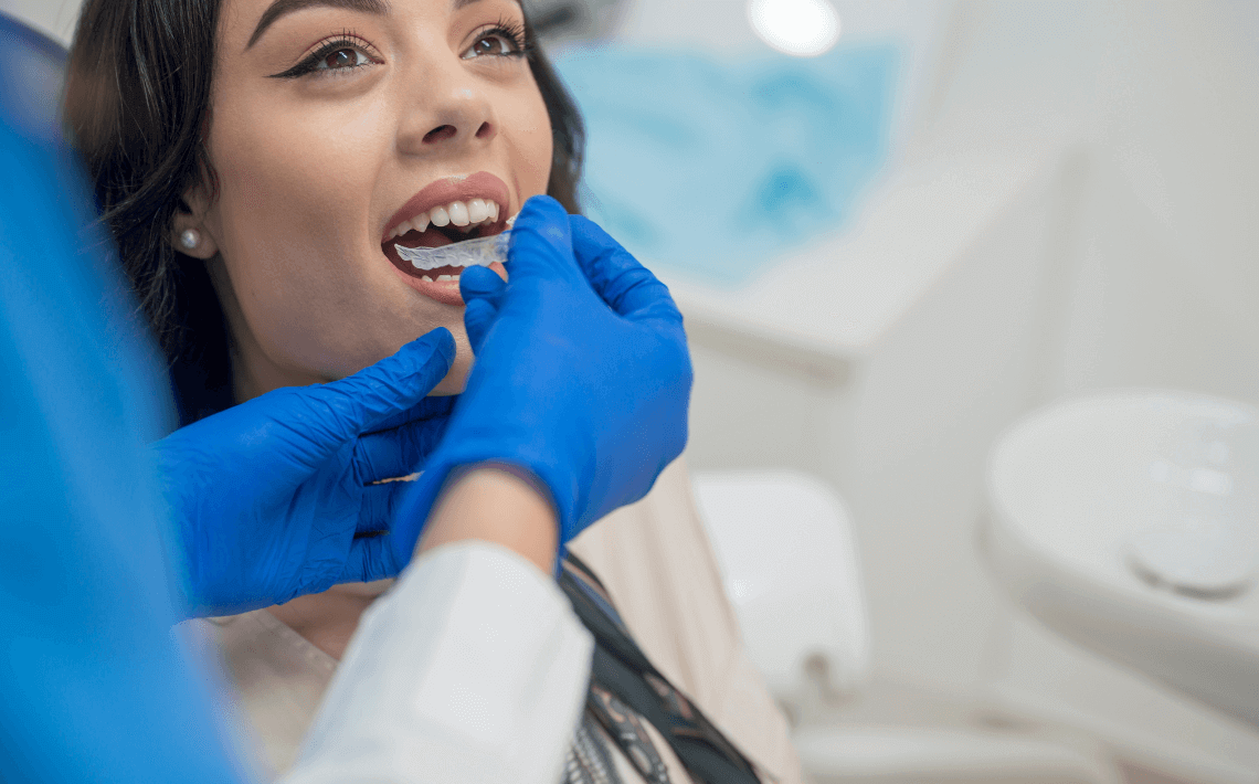 Woman receiving Invisalign treatment ta